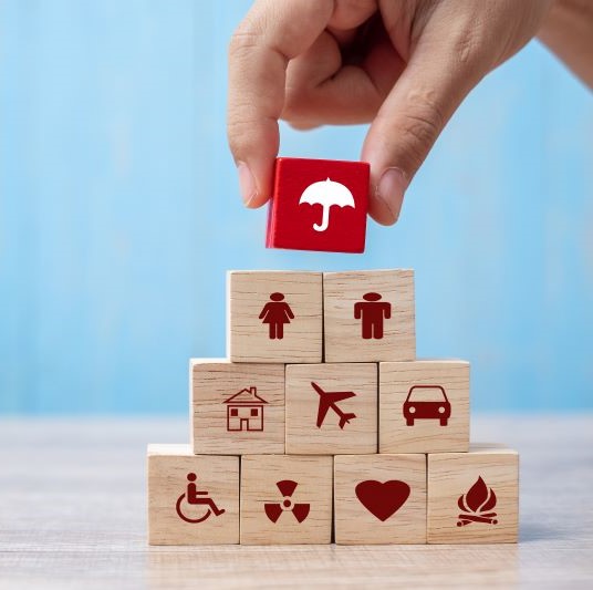 Wooden blocks depicting insurance elements