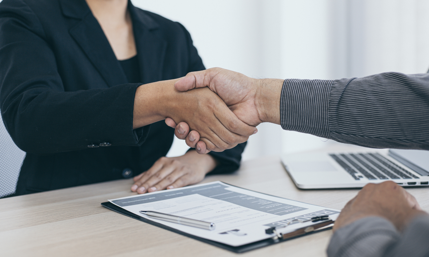 Handshake over table