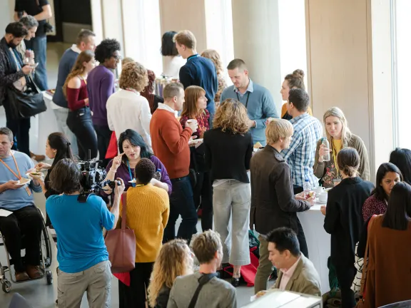 People chatting during a conference break