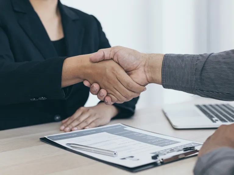 Handshake over table