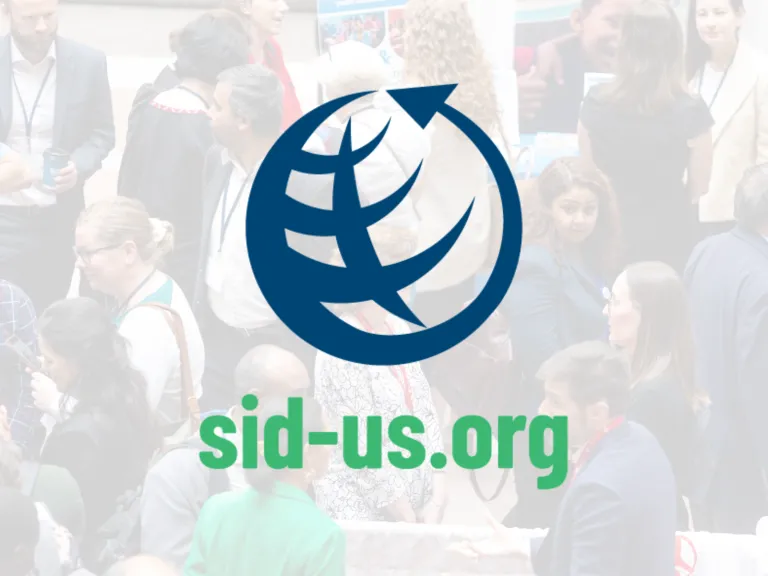 SID-US Logo (image of a globe comprised of a counter clockwise arrow with a curved vertical line in the center and intersected by three curved horizontal lines) overlaid on a semi-transparent white background over an image of people networking