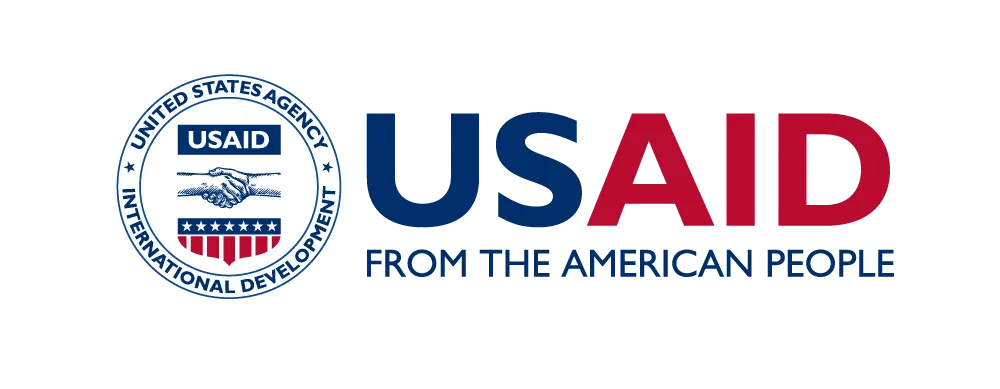 US written in blue, and AID written in red with the phrase "From the American People" written underneath and a seal on the left.